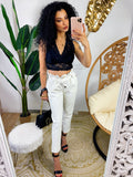 Pantalone in ecopelle con fiocco bianco