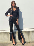 Pantalone in ecopelle con spacco