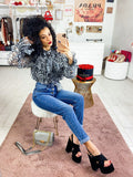 Jeans con bottoni in strass