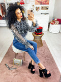 Jeans con bottoni in strass