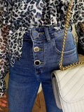 Jeans con bottoni in strass