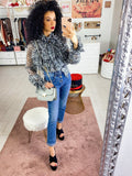 Jeans con bottoni in strass