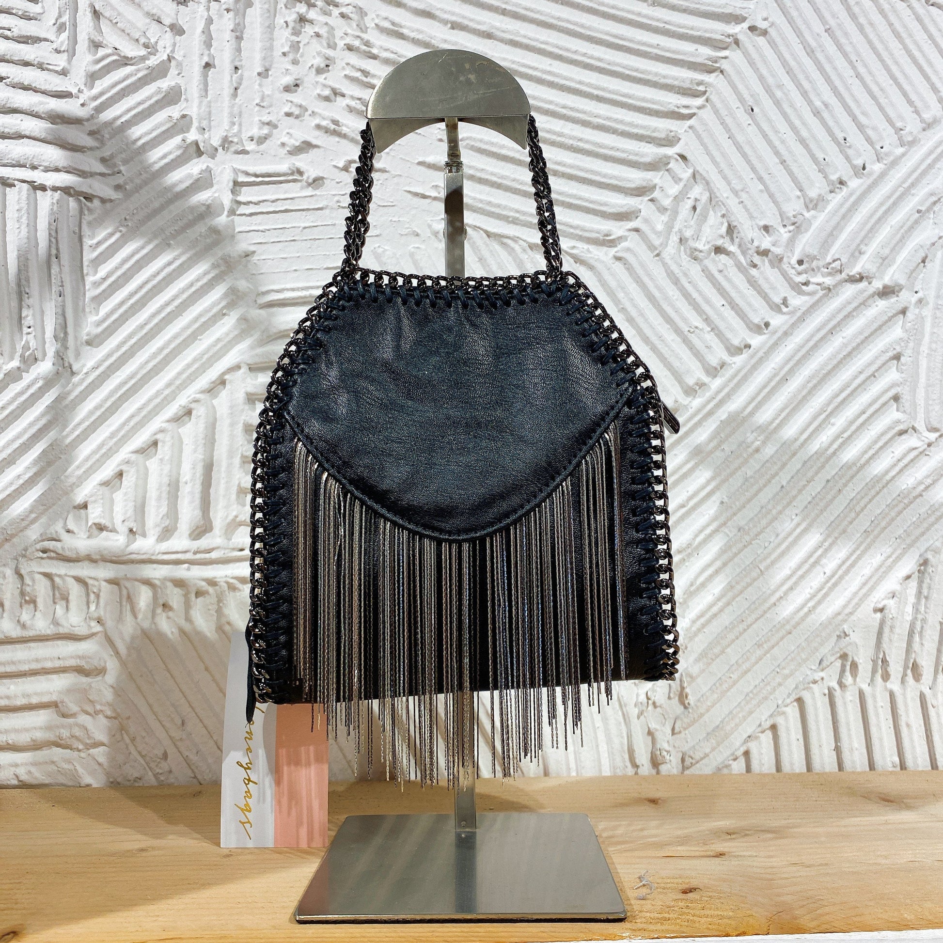 Mini pochette con frange