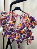 Top con fiori e schiena aperta