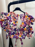 Top con fiori e schiena aperta